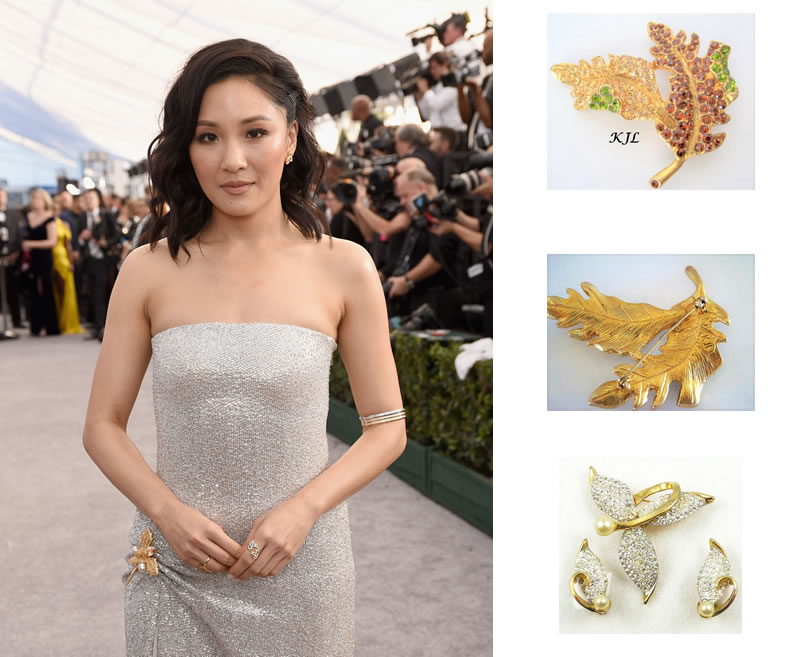 Constance Wu in a Retro Leaf Brooch Coupled with Modern Upper-Arm Bangles. GettyImages